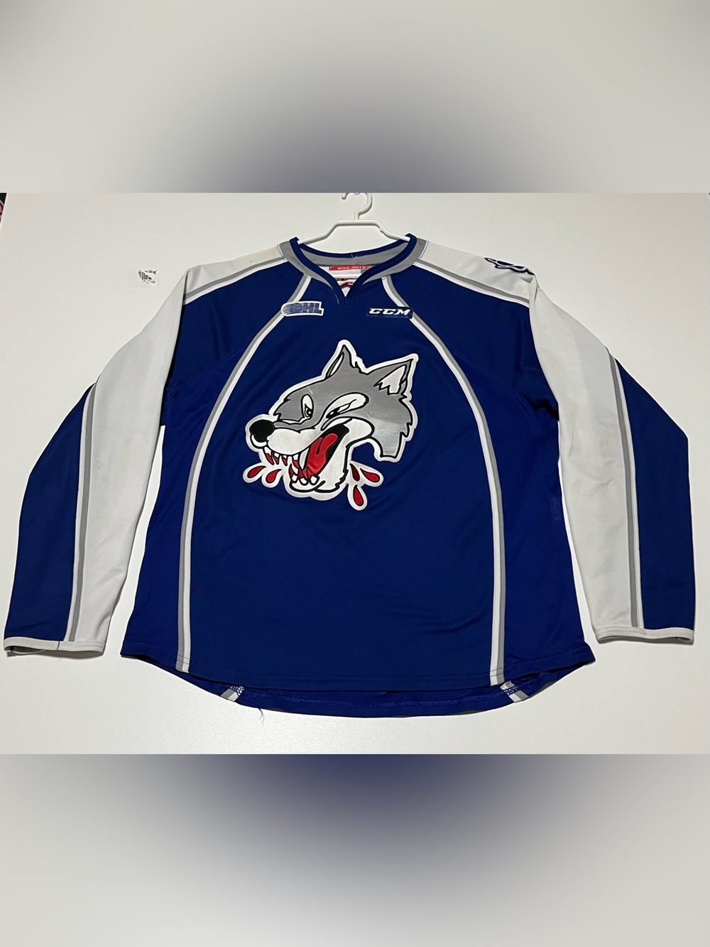 CCM Royal Blue and White Hockey Jersey with Wolf Crest